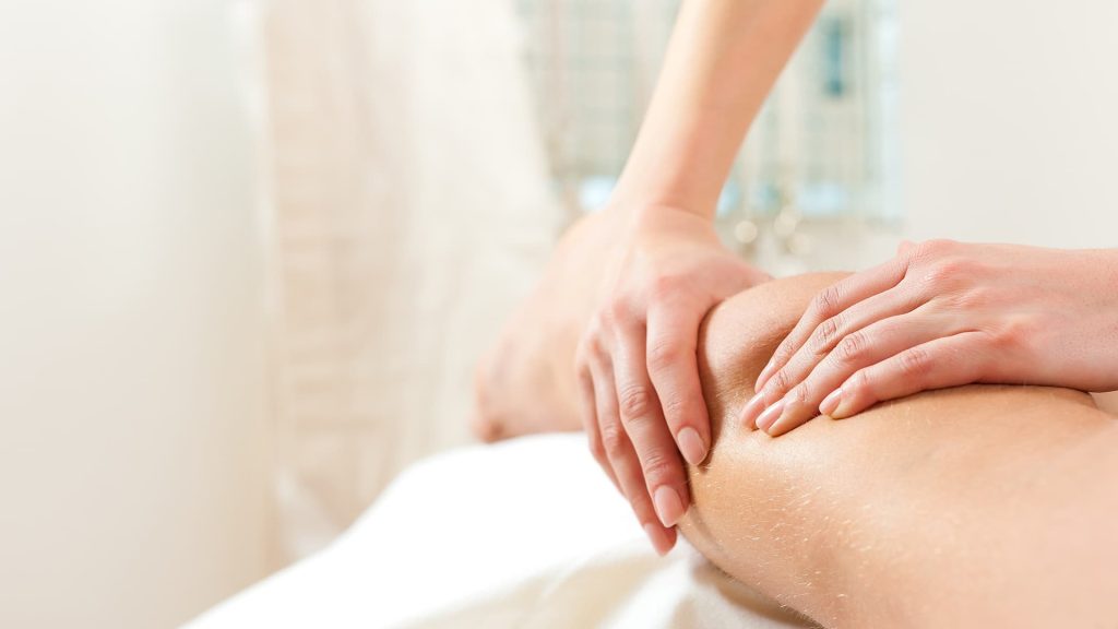 Therapist performing a gentle lymphatic drainage massage on a client at Namaste Skincare & Wellness in Henderson, part of post-op recovery care.