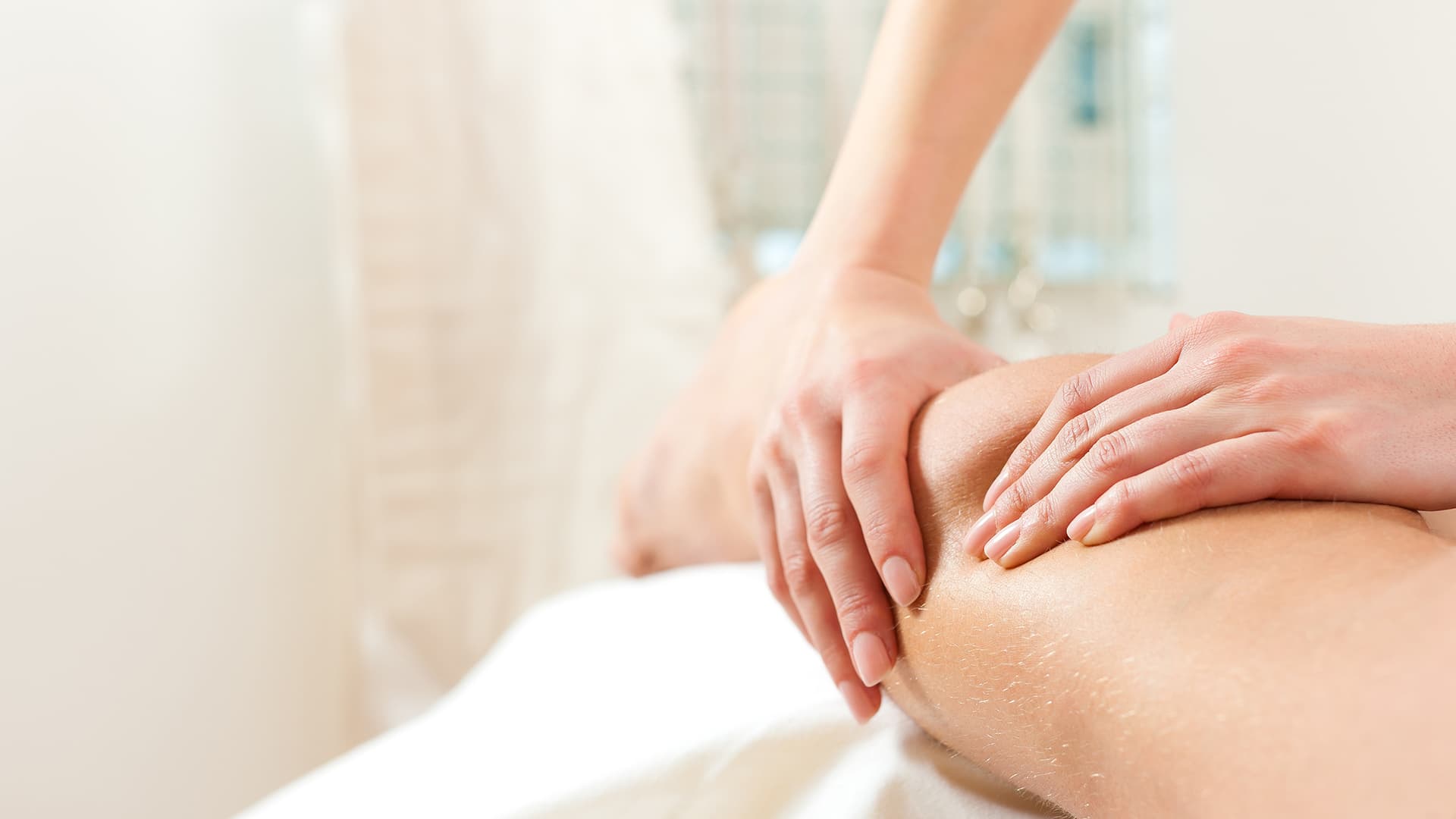 Therapist performing a gentle lymphatic drainage massage on a client at Namaste Skincare & Wellness in Henderson, part of post-op recovery care.