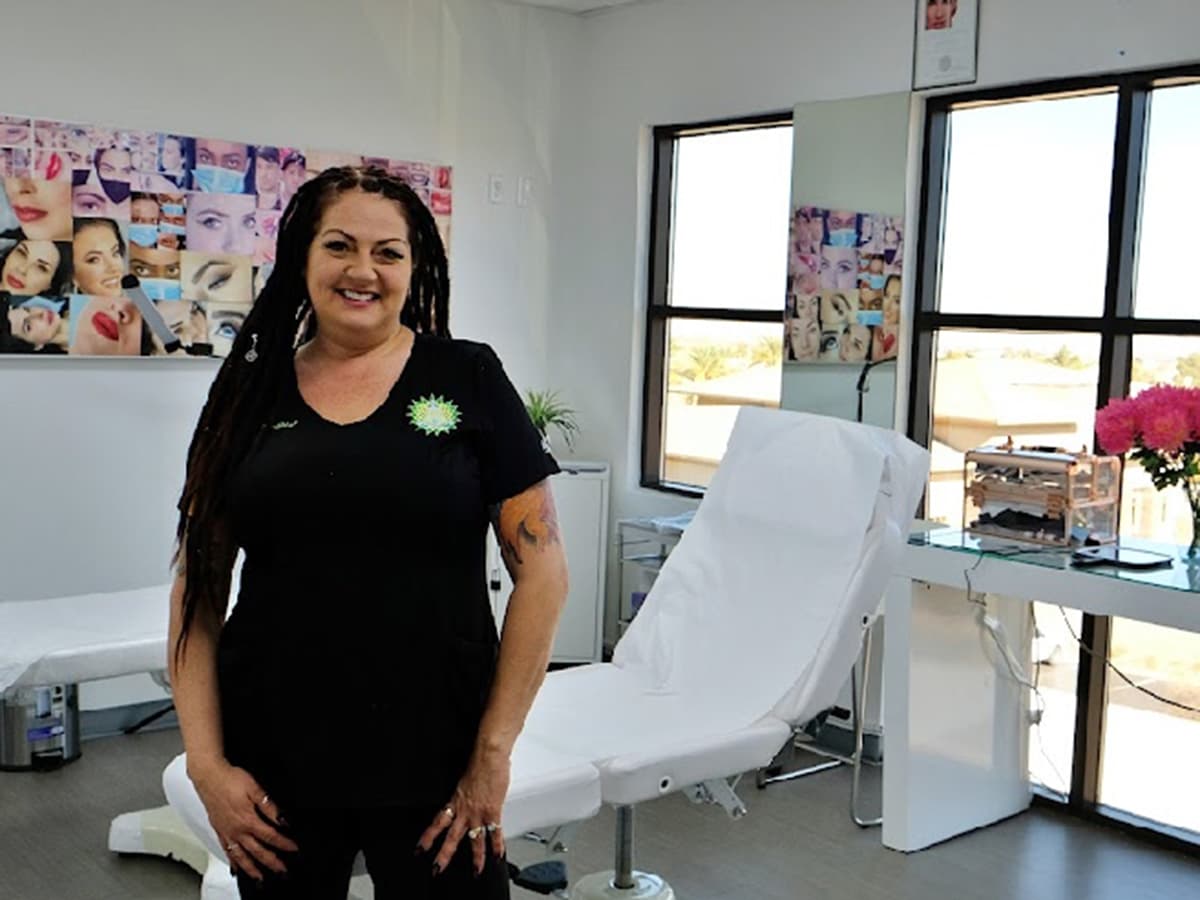 Tisha John, owner and operator of Namaste Skincare & Wellness, standing inside the treatment room at the Las Vegas location.