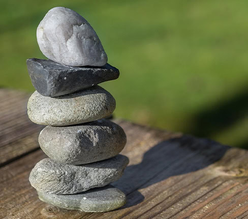 Stacked Stones Representing Balance And Calm At Namaste Skincare &Amp; Wellness.
